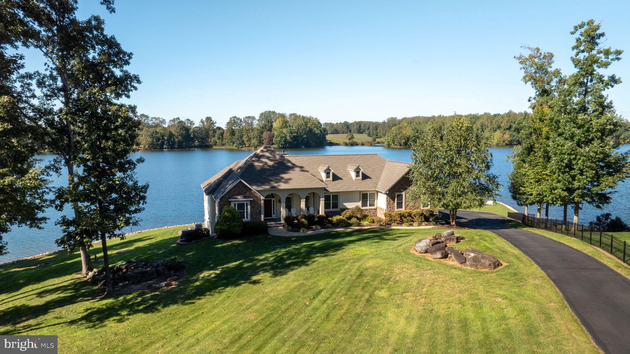 263 Lane Road Bumpass, VA 23024 - Photo 25 of 84 an aerial view of a house with swimming pool garden and patio