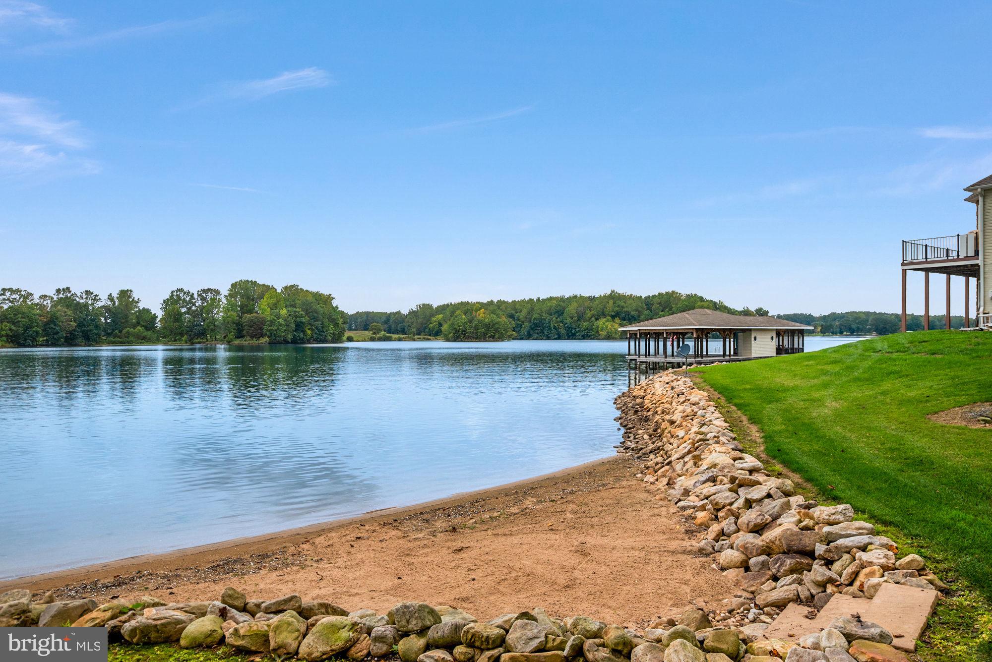 263 Lane Road Bumpass, VA 23024 - Photo 45 of 84 a view of a lake with houses in the back