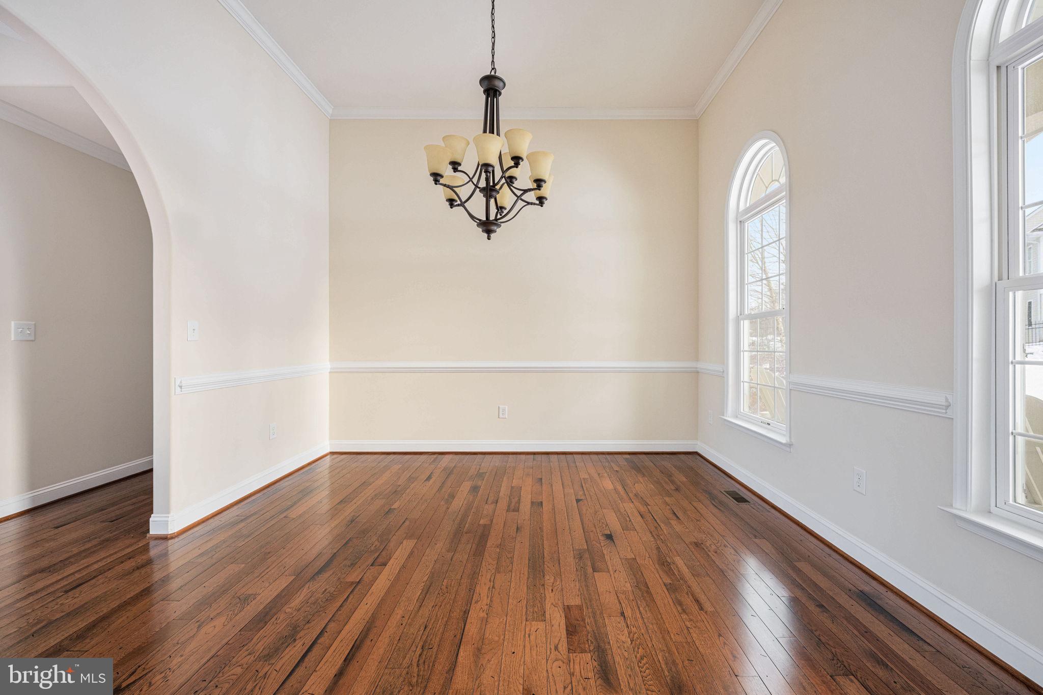 263 Lane Road Bumpass, VA 23024 - Photo 57 of 84 an empty room with wooden floor and windows