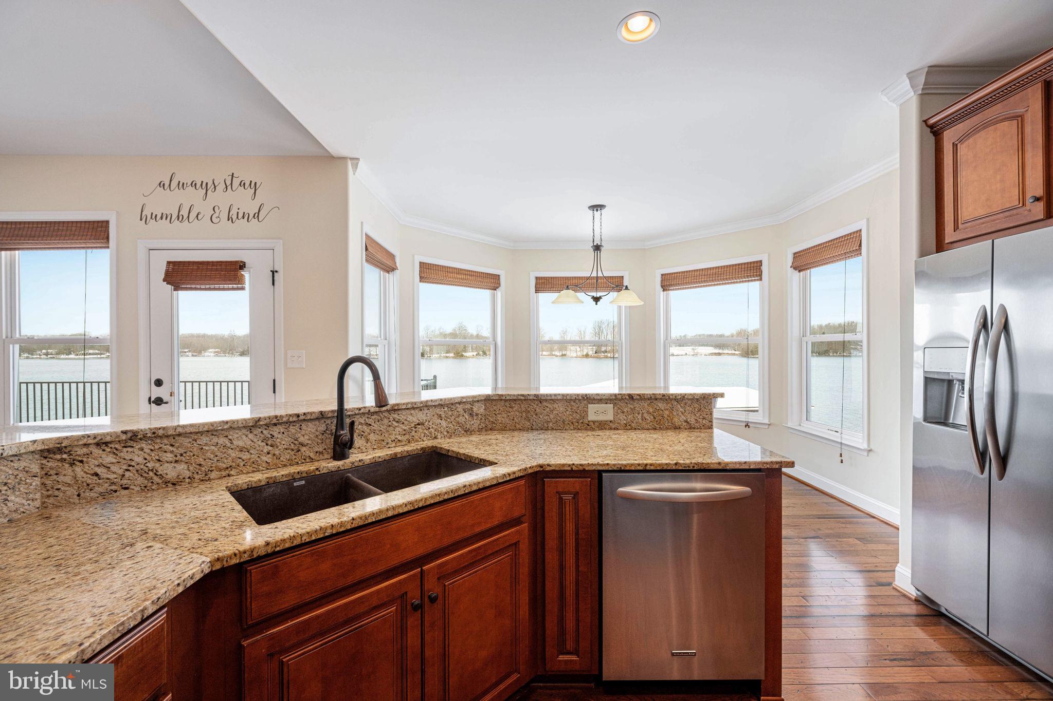 263 Lane Road Bumpass, VA 23024 - Photo 65 of 84 a kitchen with stainless steel appliances granite countertop a sink a counter space and a window