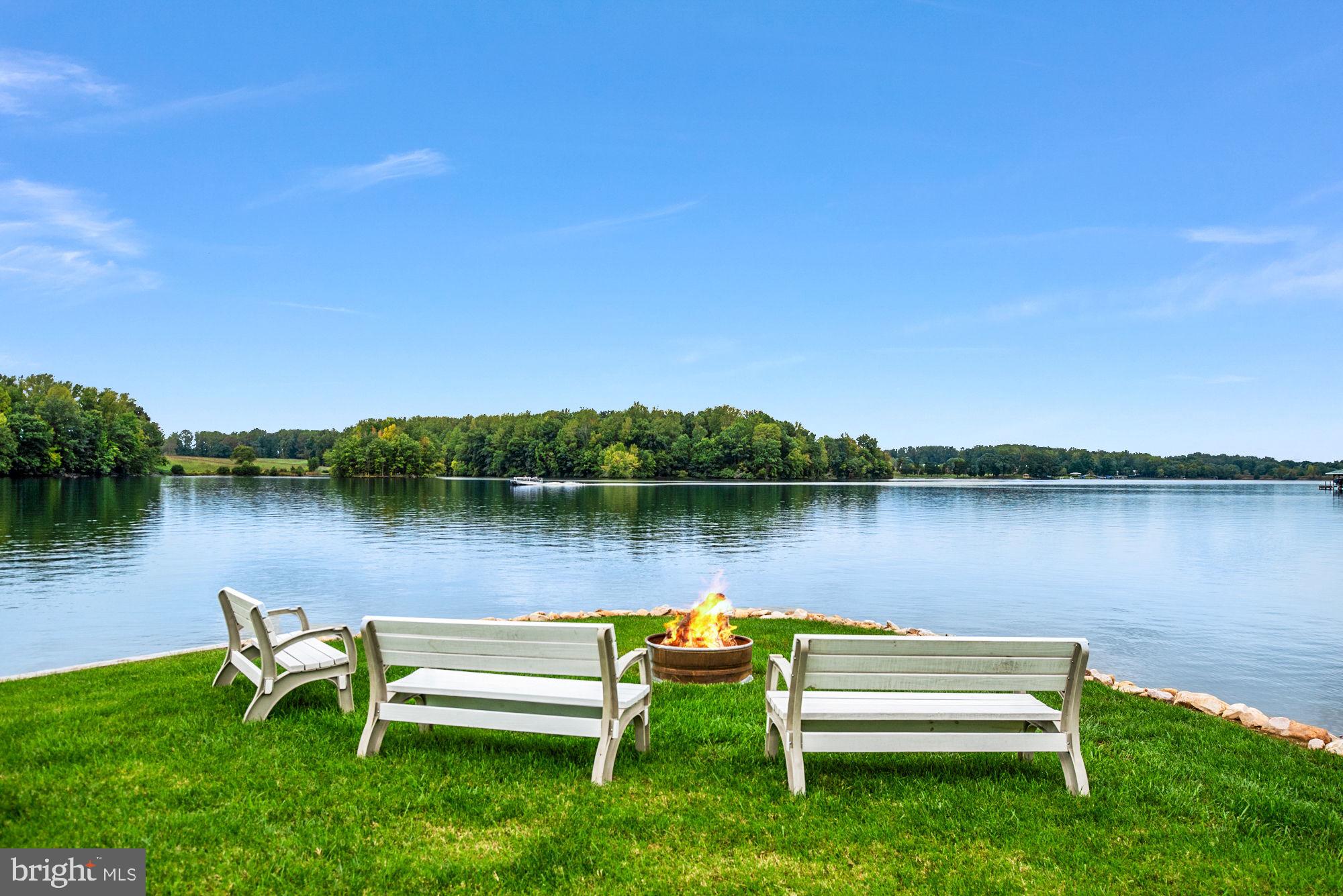 263 Lane Road Bumpass, VA 23024 - Photo 7 of 84 a view of a lake with sitting area and a lake view