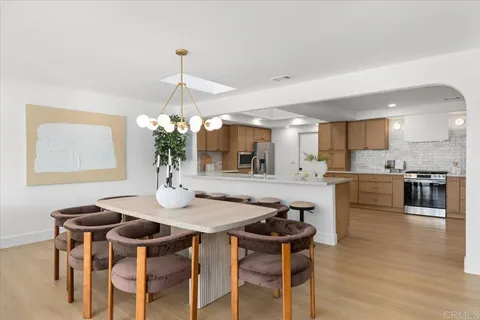 a kitchen with a table and chairs in it