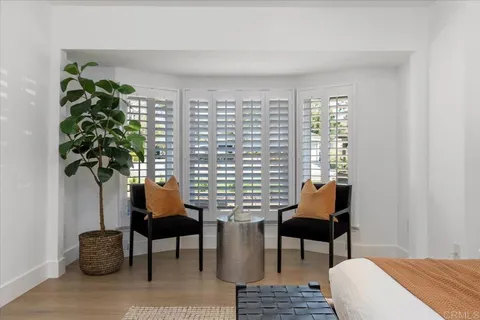 a workspace with furniture and a window