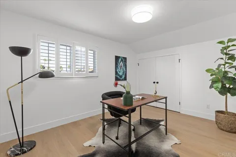 a bathroom with a double vanity sink toilet mirror and shower