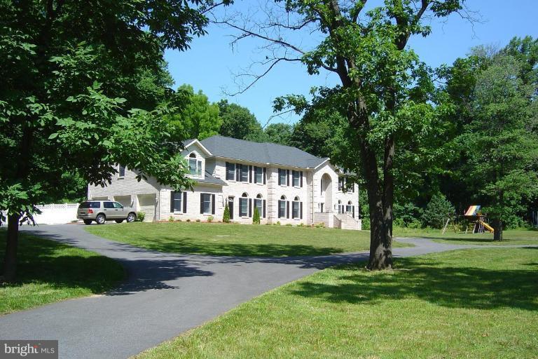 622 Church Road Reisterstown, MD 21136 - Photo 2 of 21 a front view of a house with a garden