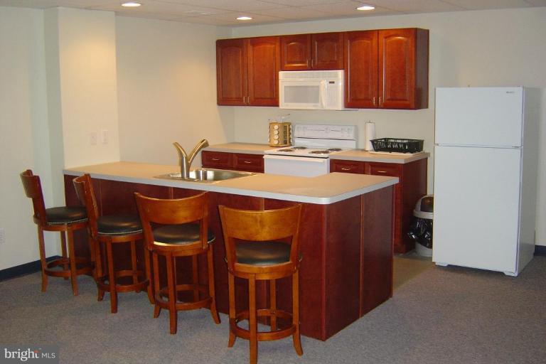 622 Church Road Reisterstown, MD 21136 - Photo 12 of 21 a dining hall with a sink and a refrigerator