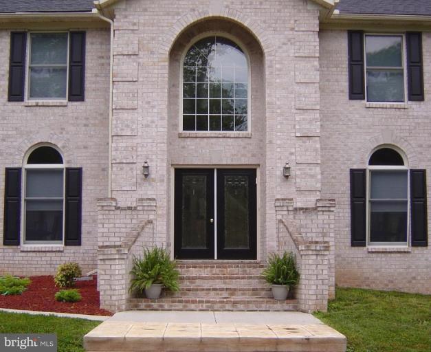 622 Church Road Reisterstown, MD 21136 - Photo 19 of 21 a front view of a house with garden