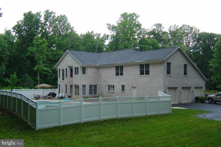 622 Church Road Reisterstown, MD 21136 - Photo 3 of 21 a front view of house with yard and trees in the background