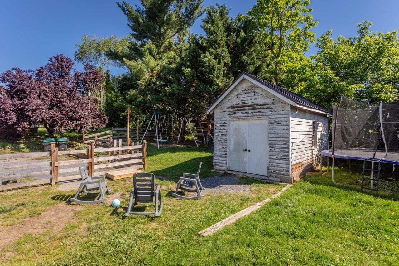 420 West Spring Street Woodstock, VA 22664 - Photo 62 of 67 a backyard of a house with table and chairs