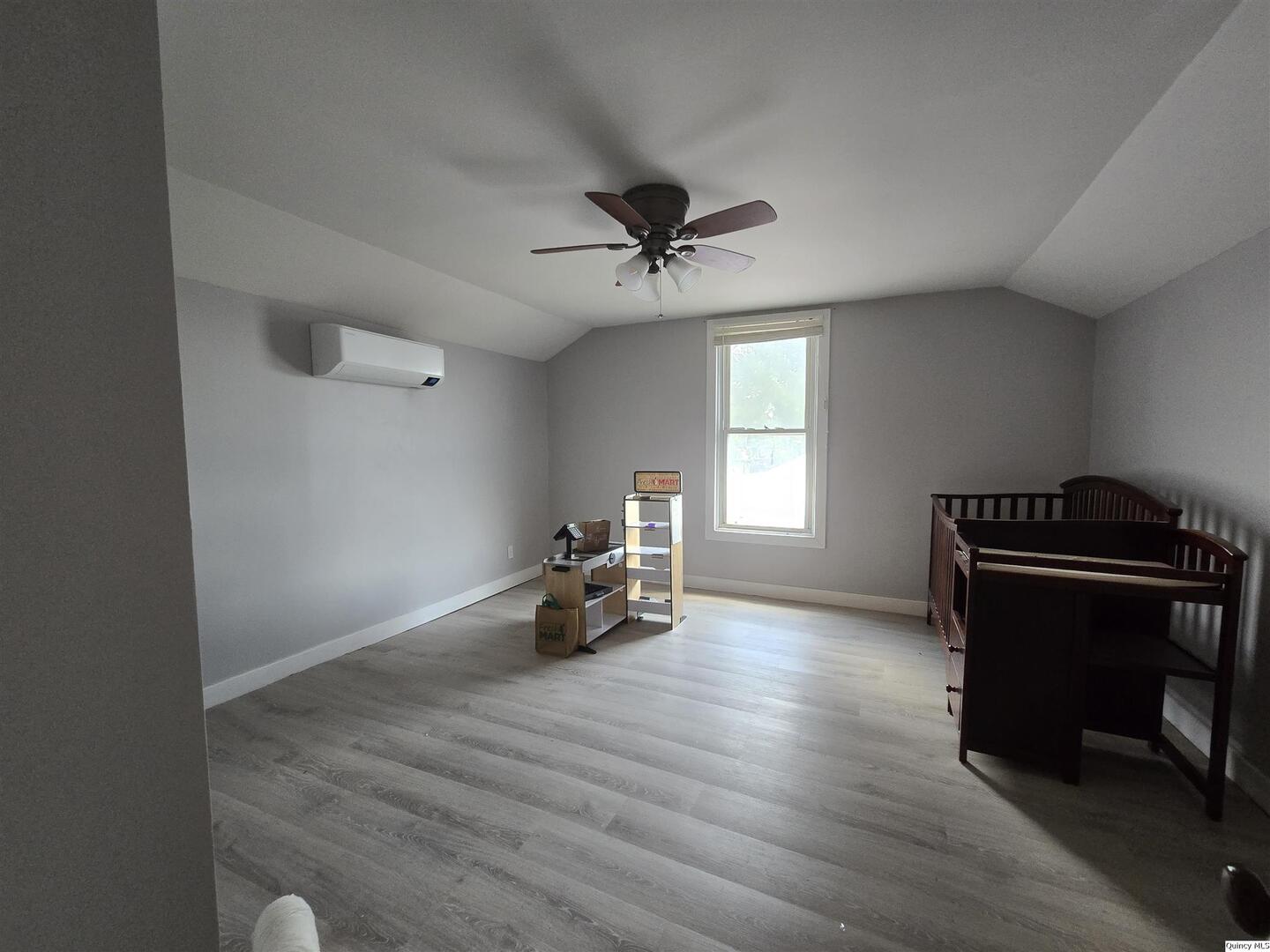 112 North Walnut Street Versailles, IL 62378 - Photo 16 of 18 a living room with furniture and a window