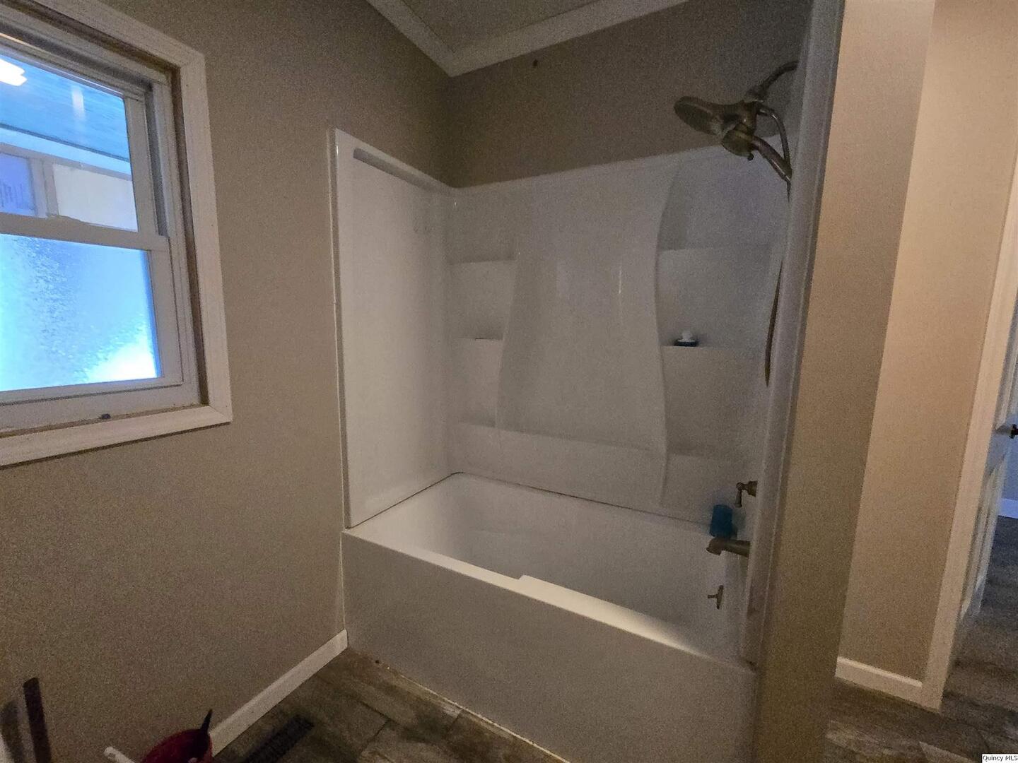 112 North Walnut Street Versailles, IL 62378 - Photo 10 of 18 a bathroom with a bathtub