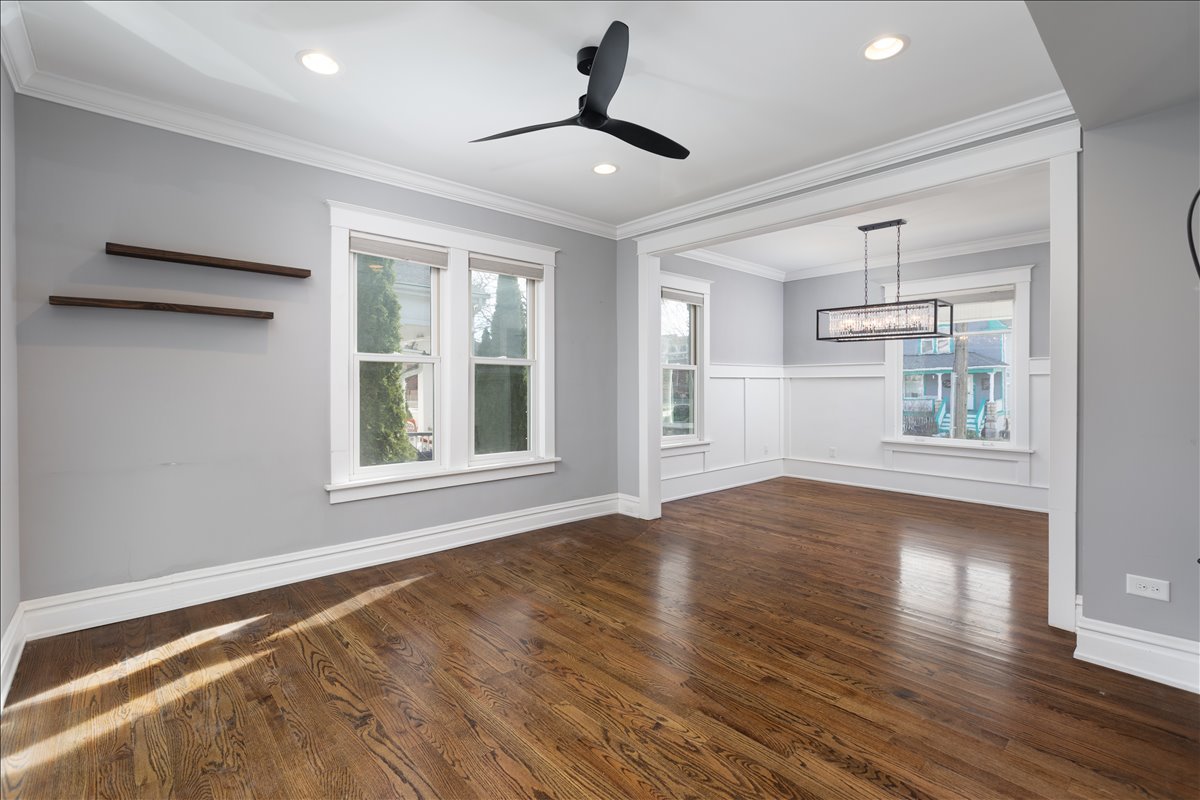 18 North Main Street Naperville, IL 60540 - Photo 13 of 32 a view of an empty room with window and wooden floor