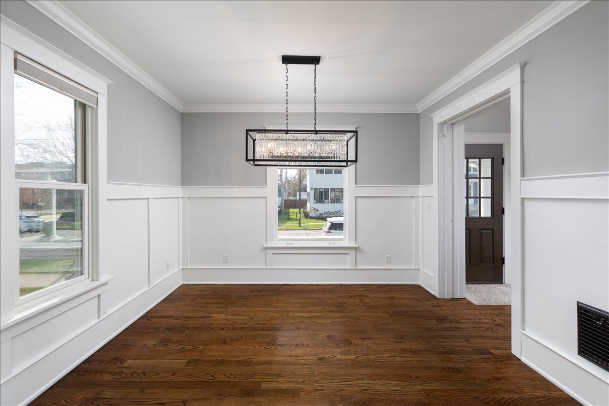 18 North Main Street Naperville, IL 60540 - Photo 14 of 32 a view of empty room with window and wooden floor
