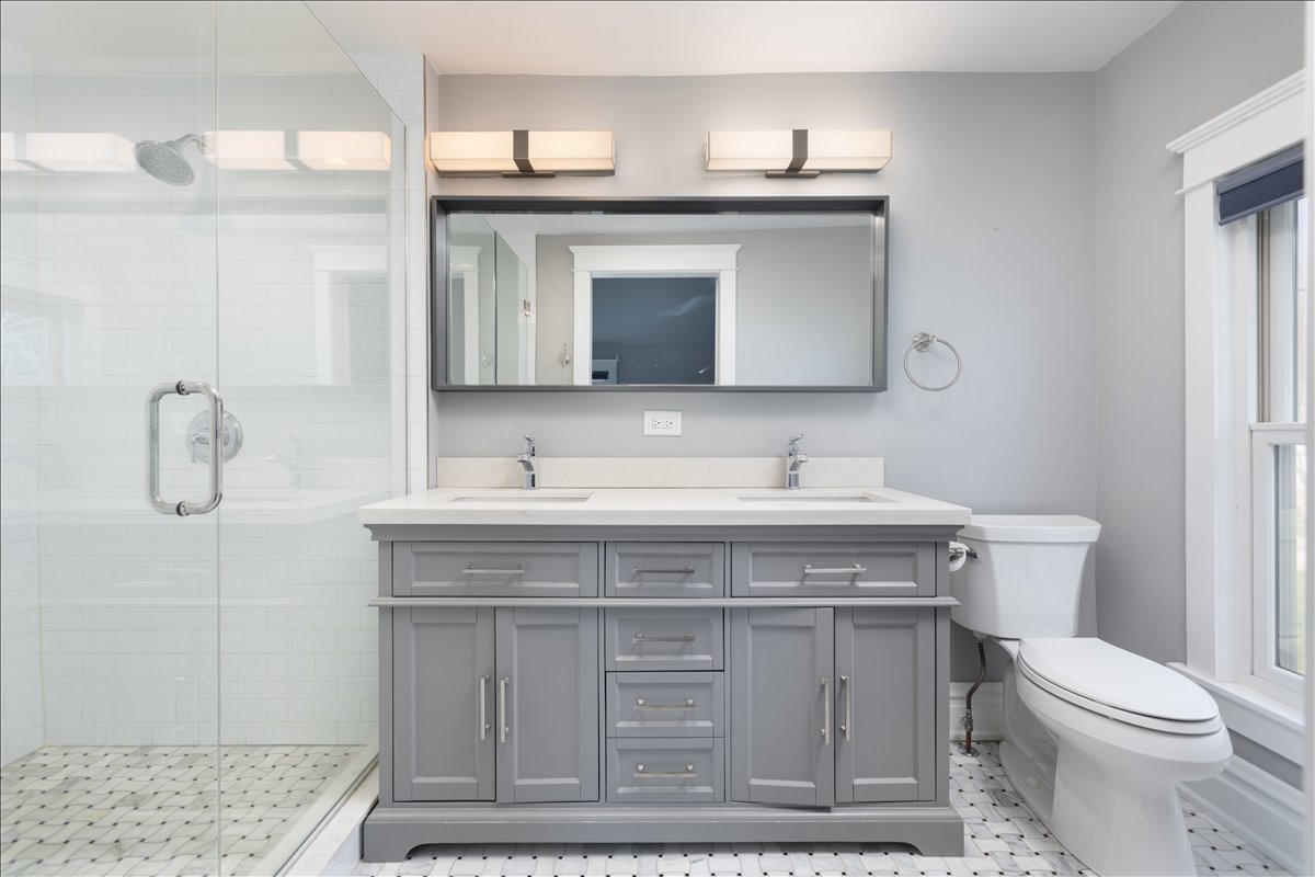 18 North Main Street Naperville, IL 60540 - Photo 20 of 32 a bathroom with a sink vanity and toilet