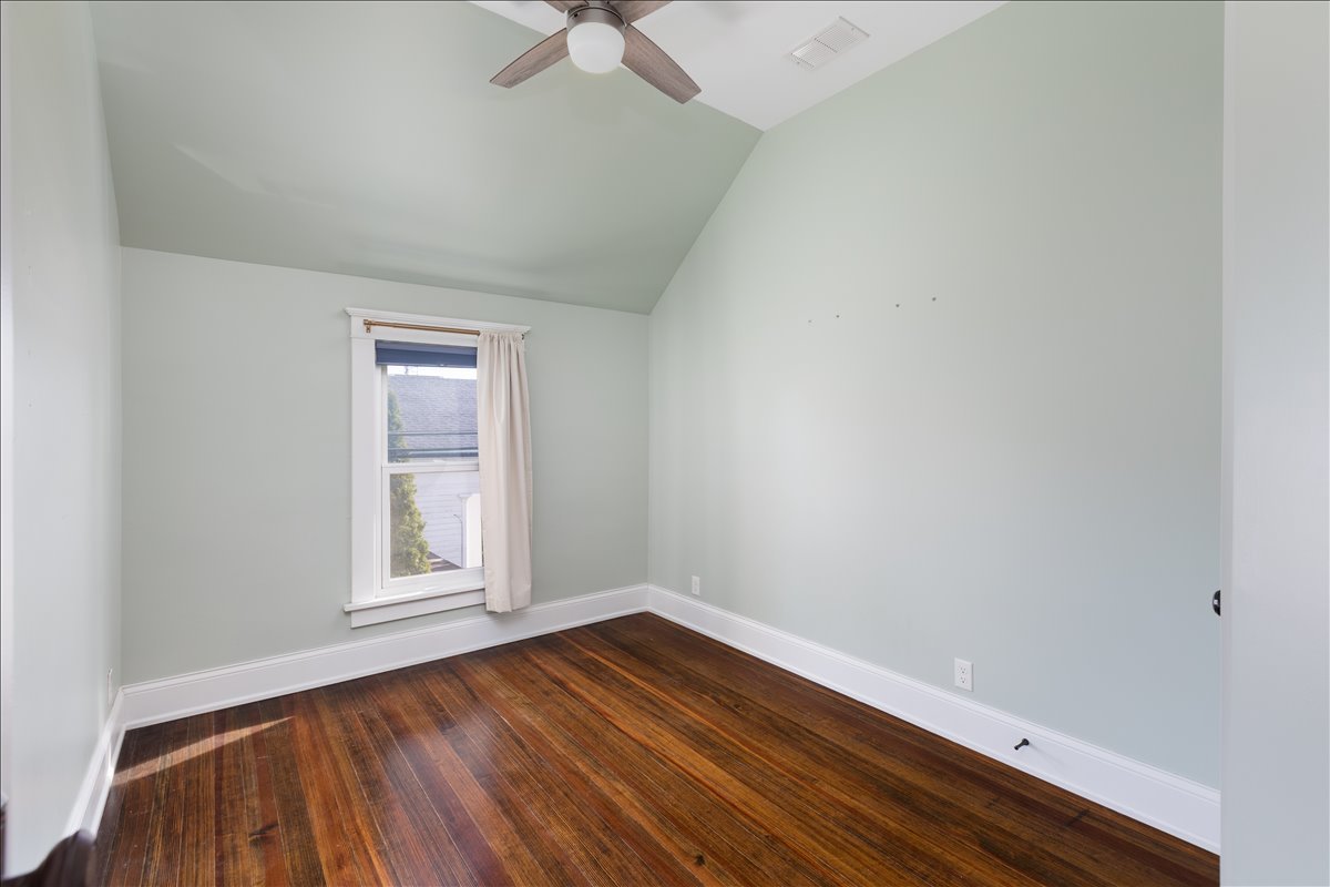 18 North Main Street Naperville, IL 60540 - Photo 23 of 32 an empty room with wooden floor and windows