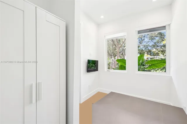 a bathroom with a double sink shower and a mirror