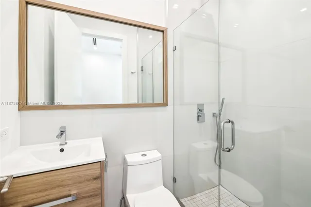 a bathroom with a shower and a sink