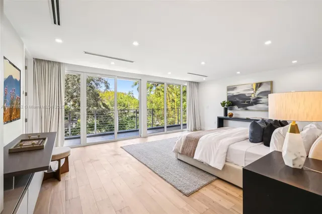 a white toilet sitting next to a shower curtain