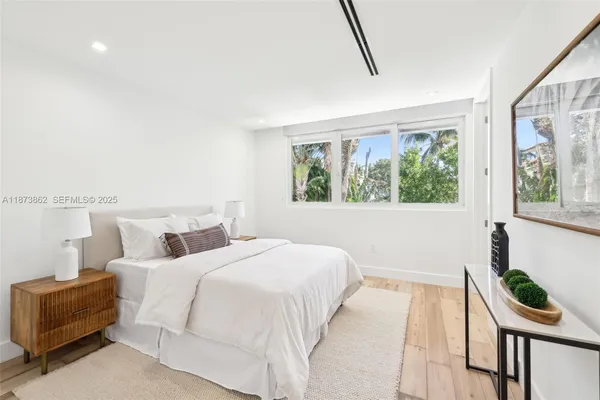 a view of a patio with a table chairs and a fire pit