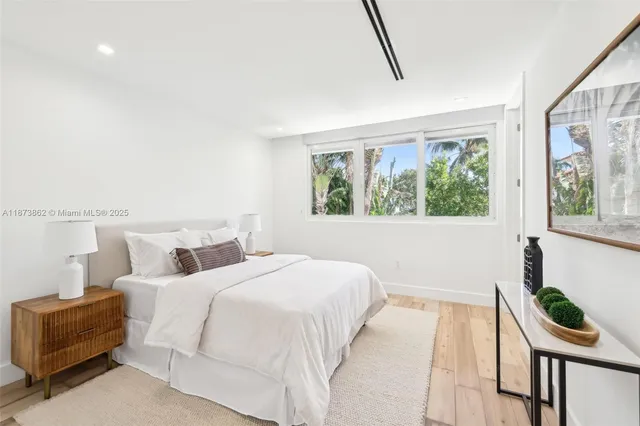 a view of a patio with a table chairs and a fire pit