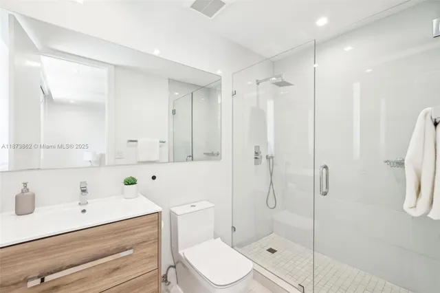 a view of a chair and table in backyard of the house