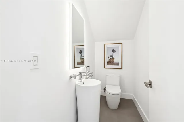 a living room with fireplace furniture and a large window