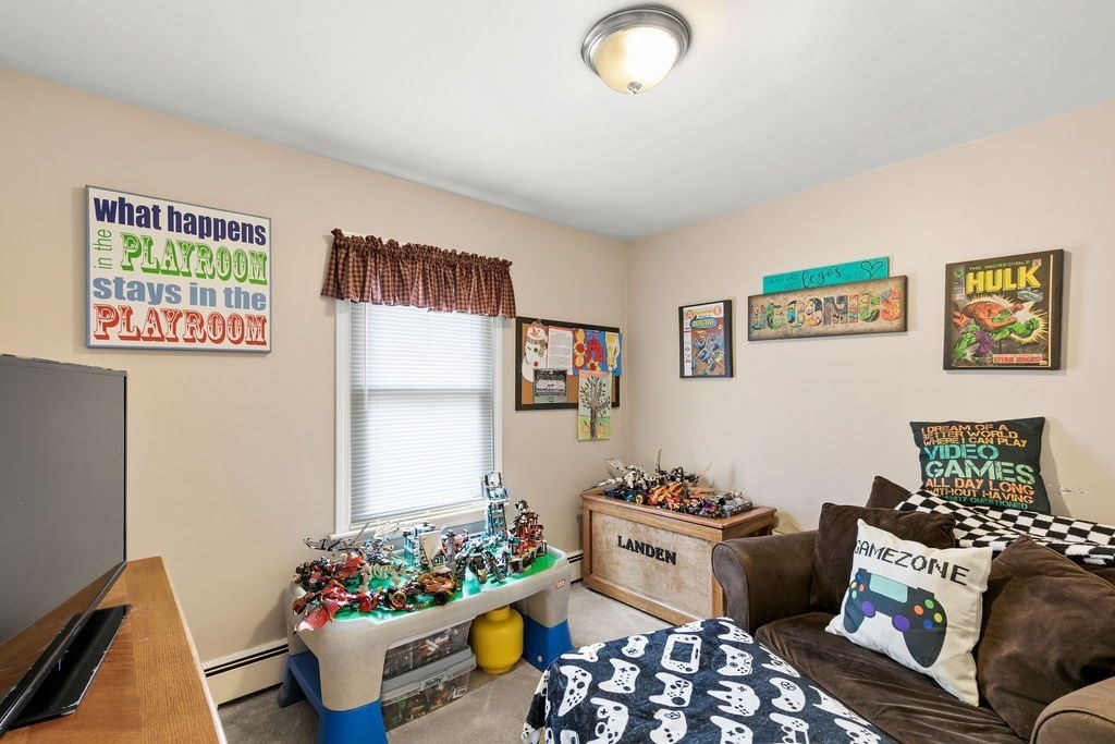 11 Fuller Road Attleboro, MA 02703 - Photo 13 of 21 a living room with furniture and flowers
