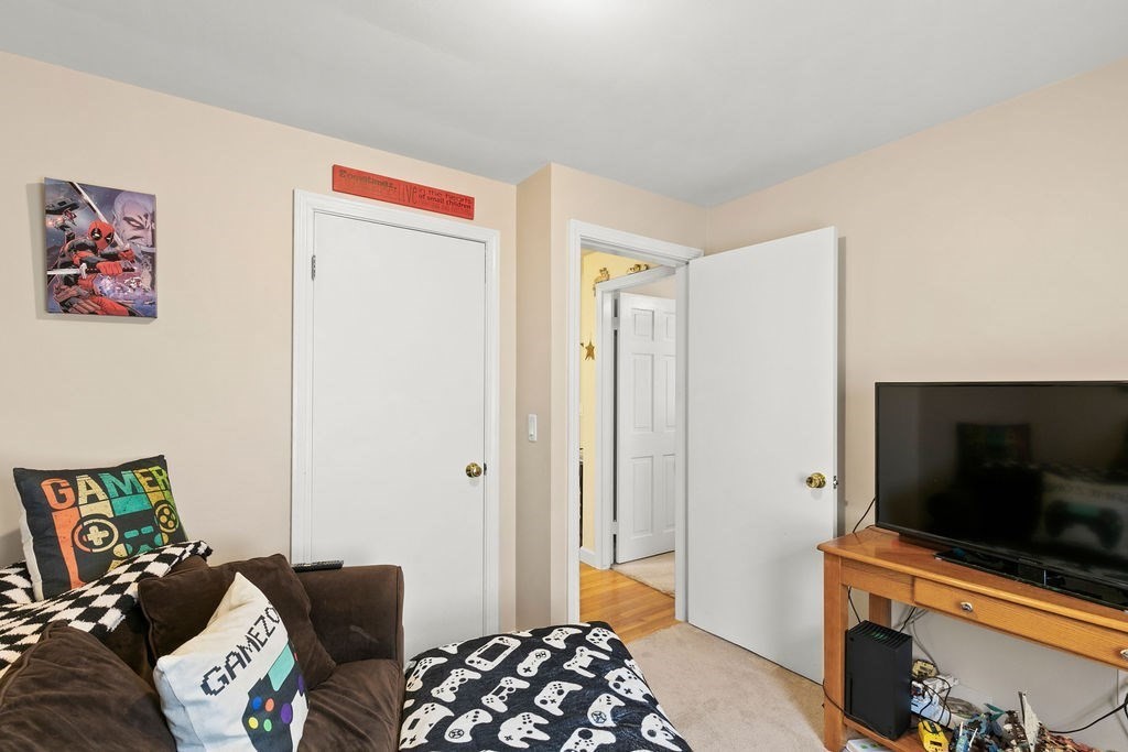 11 Fuller Road Attleboro, MA 02703 - Photo 14 of 21 a bedroom with a bed and a flat screen tv