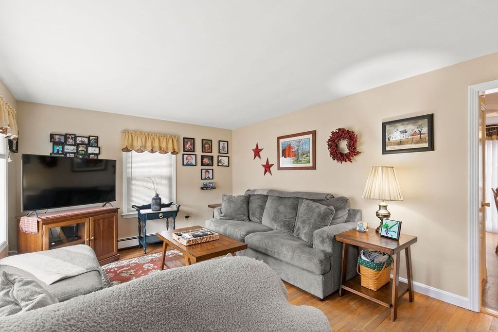 11 Fuller Road Attleboro, MA 02703 - Photo 15 of 21 a living room with furniture and a flat screen tv