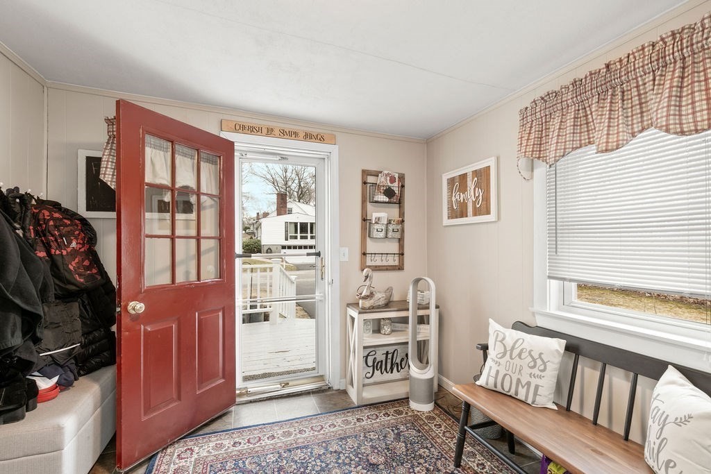 11 Fuller Road Attleboro, MA 02703 - Photo 4 of 21 a living room with furniture a rug and a window