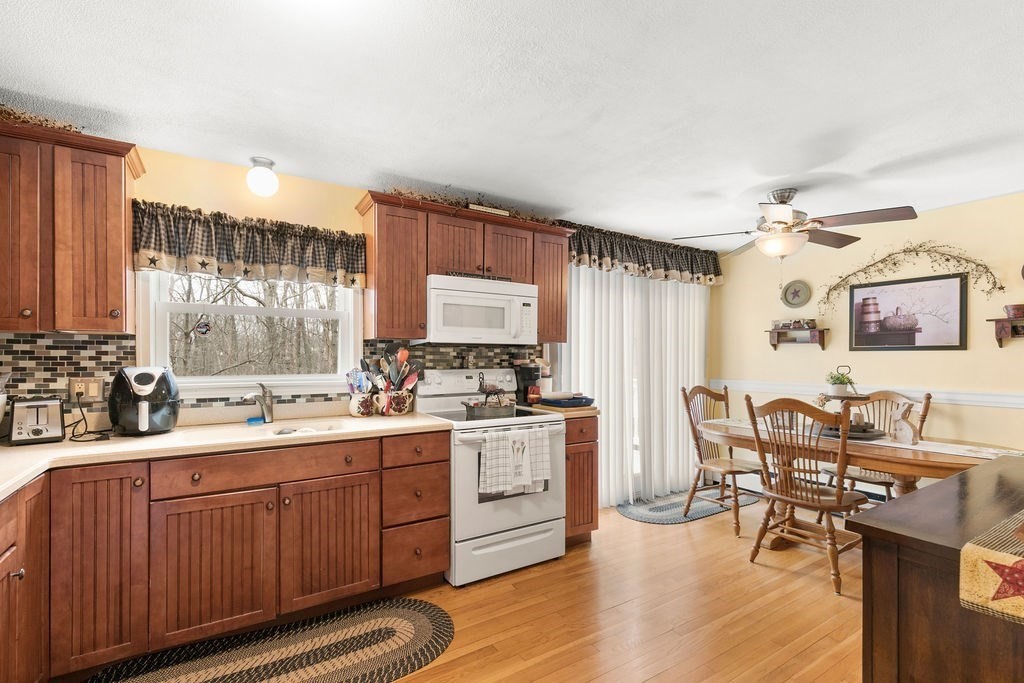 11 Fuller Road Attleboro, MA 02703 - Photo 6 of 21 a kitchen with a sink stove and cabinets
