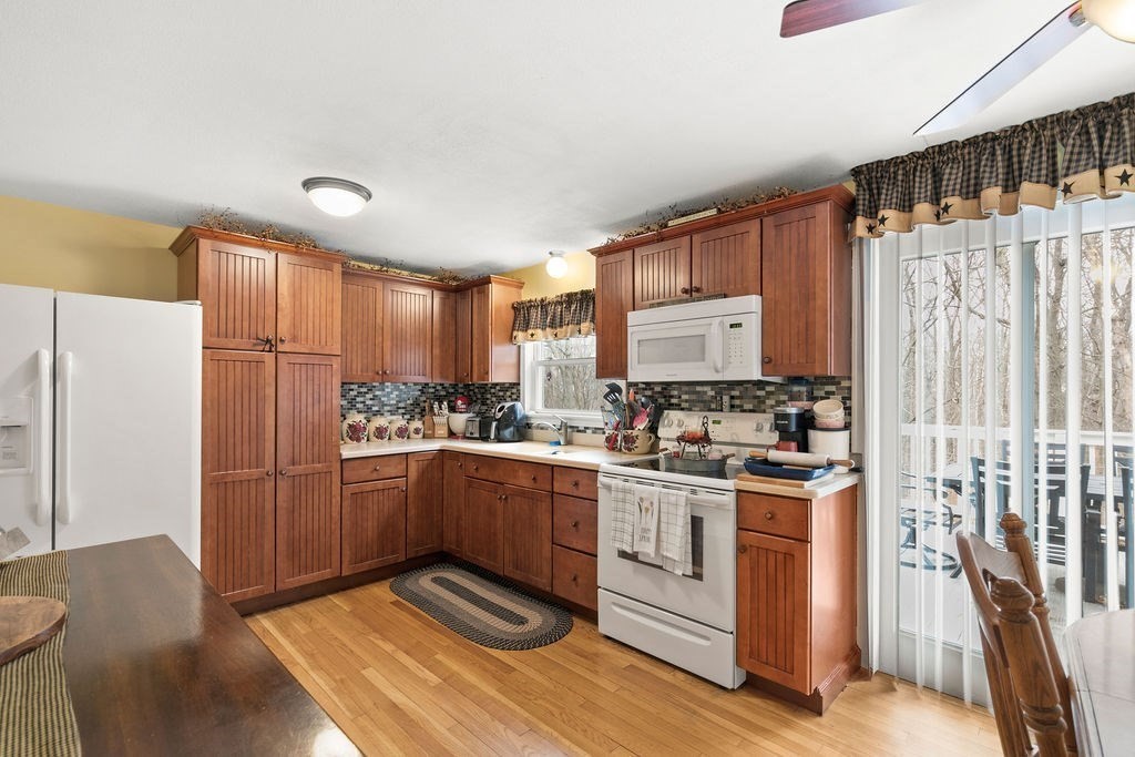 11 Fuller Road Attleboro, MA 02703 - Photo 7 of 21 a kitchen with stainless steel appliances granite countertop a stove a sink and a refrigerator