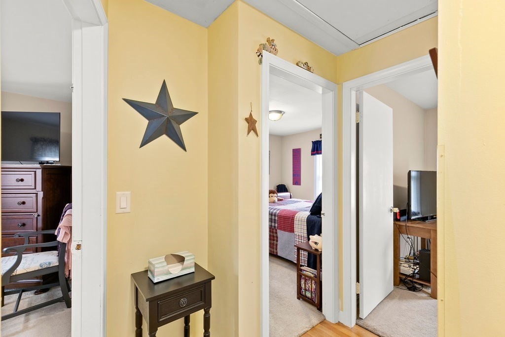 11 Fuller Road Attleboro, MA 02703 - Photo 10 of 21 a view of a hallway with workspace and a living room