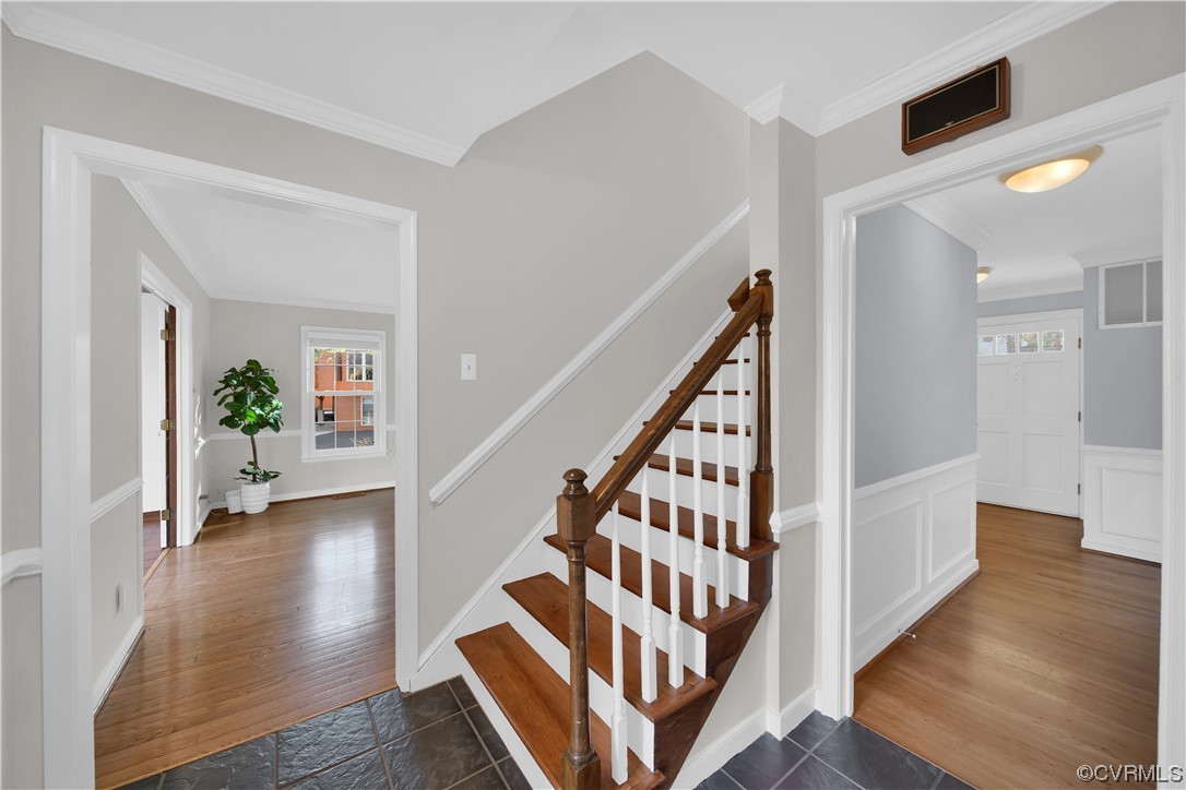 8307 Spring Meadow Road North Chesterfield, VA 23235 - Photo 21 of 47 a view of a hallway with wooden floor and stairs