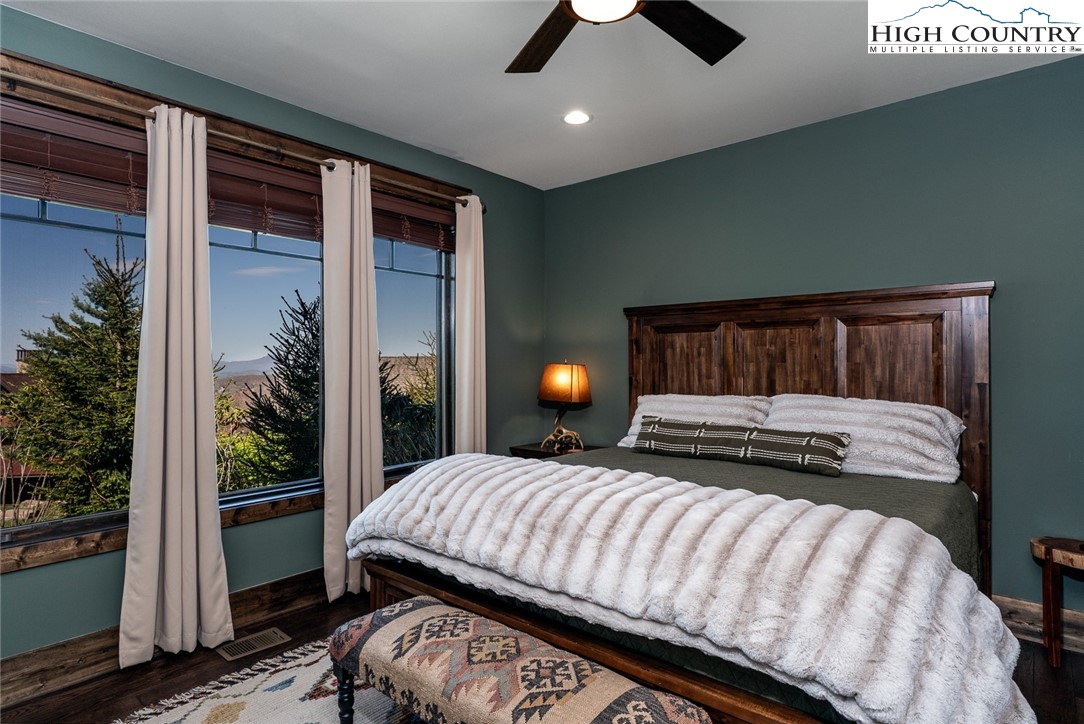 344 High Country Overlook Banner Elk, NC 28604 - Photo 12 of 48 a bedroom with a bed and wooden floor