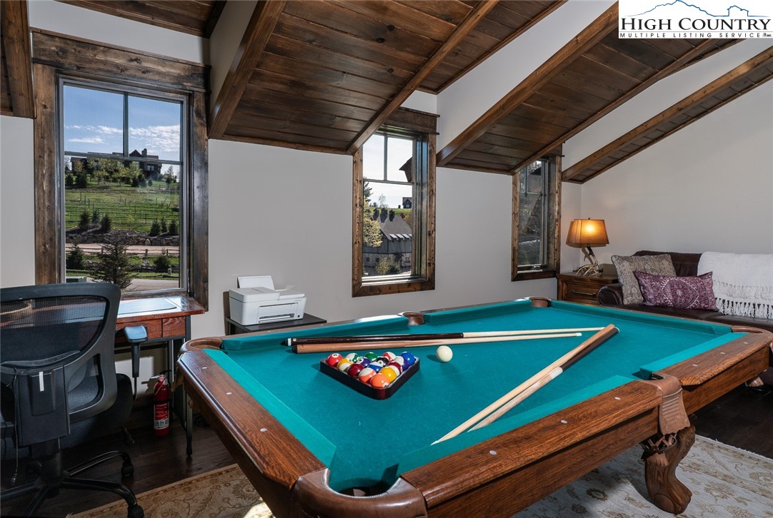 344 High Country Overlook Banner Elk, NC 28604 - Photo 21 of 48 a room with pool table table soccer and a chandelier