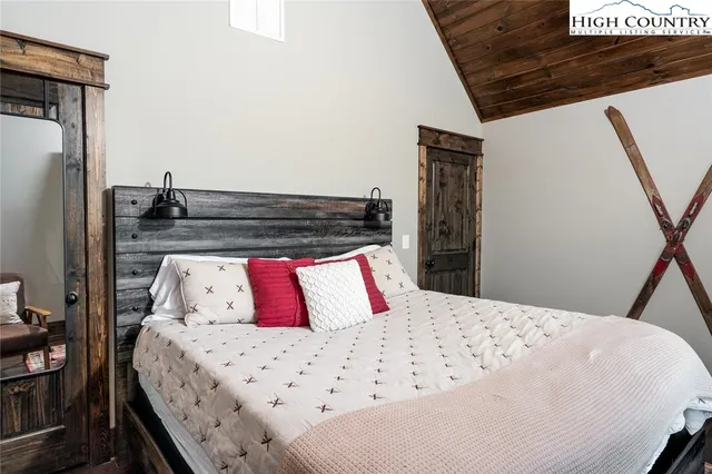 a bathroom with a granite countertop bathtub shower sink vanity and toilet