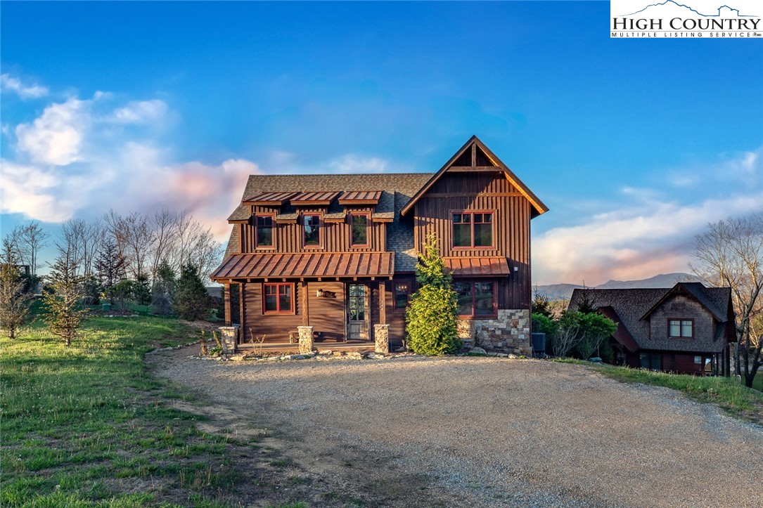 344 High Country Overlook Banner Elk, NC 28604 - Photo 3 of 48 a view of a big house with a big yard plants and large trees