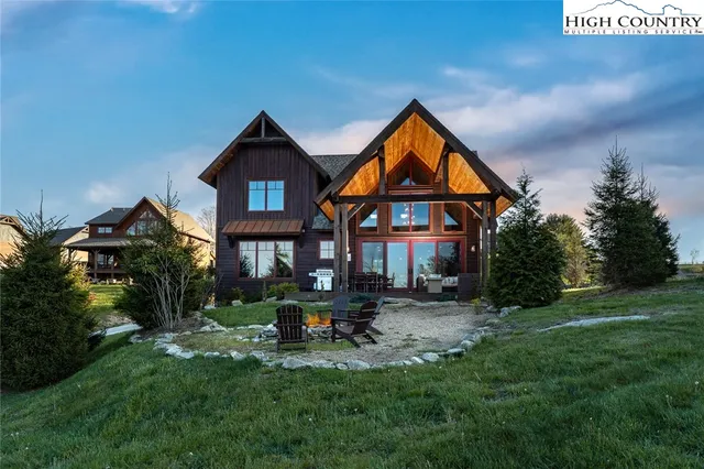 an aerial view of a house with garden space and street view
