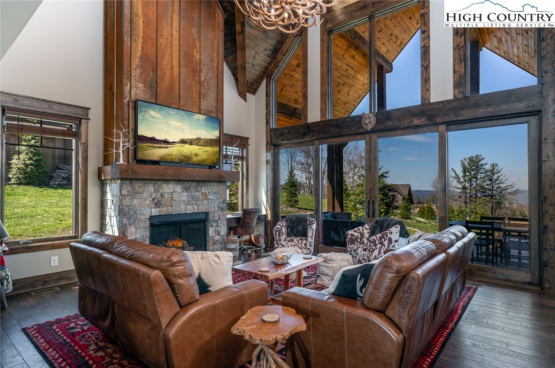 344 High Country Overlook Banner Elk, NC 28604 - Photo 4 of 48 a living room with furniture a large window and a fireplace