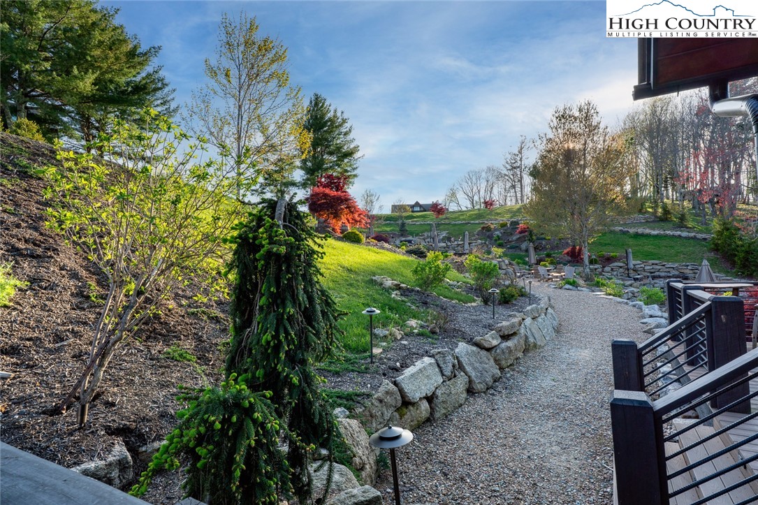 344 High Country Overlook Banner Elk, NC 28604 - Photo 47 of 48 a lake view with sitting space and garden view
