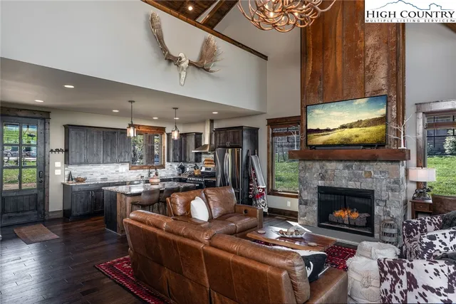 a living room with furniture fireplace and flat screen tv