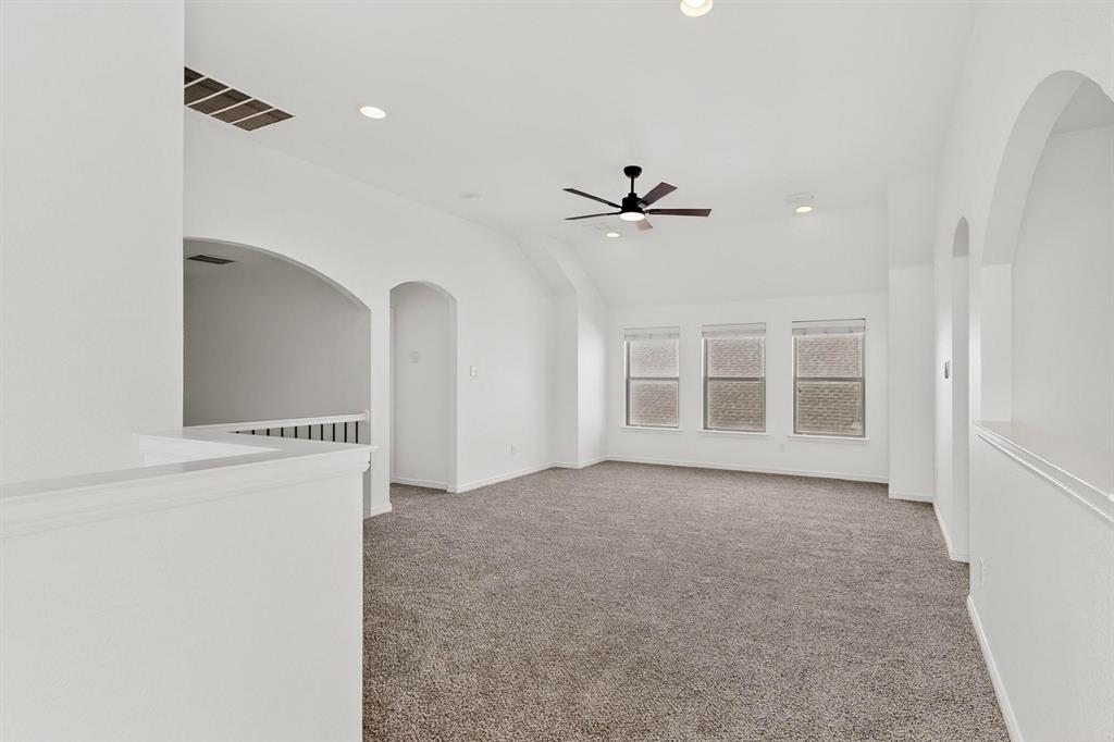 174 Hampton Drive Fate, TX 75087 - Photo 12 of 40 a view of an empty room with a window