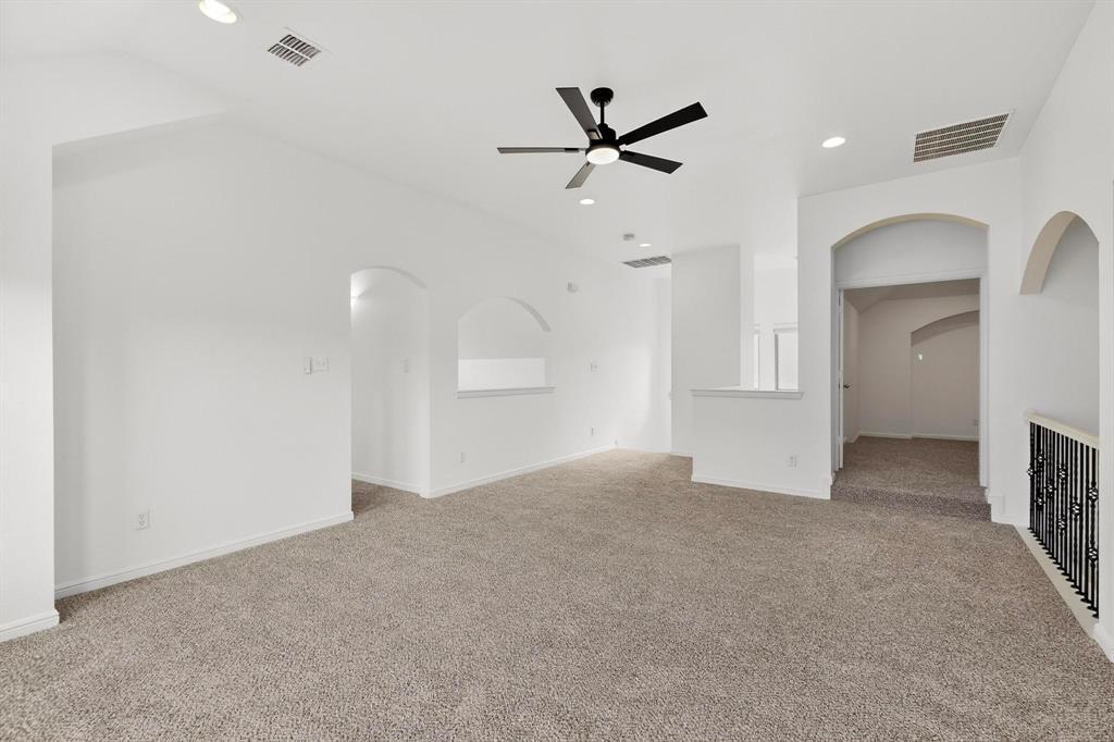 174 Hampton Drive Fate, TX 75087 - Photo 13 of 40 a view of a livingroom with a fireplace