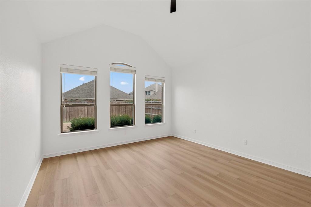 174 Hampton Drive Fate, TX 75087 - Photo 14 of 40 wooden floor in an empty room