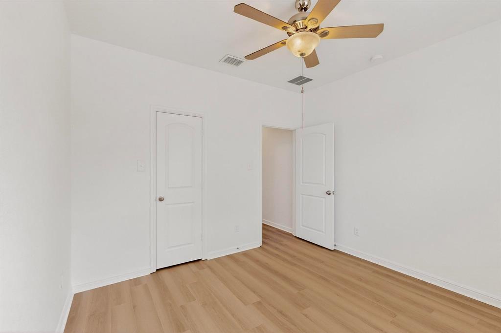 174 Hampton Drive Fate, TX 75087 - Photo 21 of 40 wooden floor in an empty room