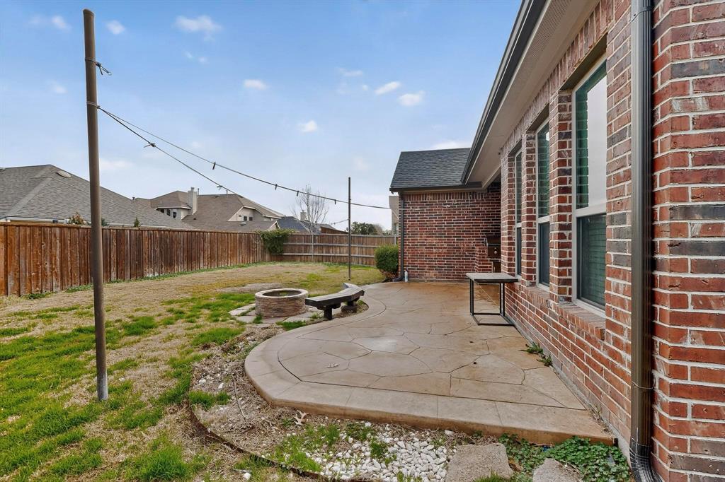 174 Hampton Drive Fate, TX 75087 - Photo 38 of 40 a house view with a backyard space