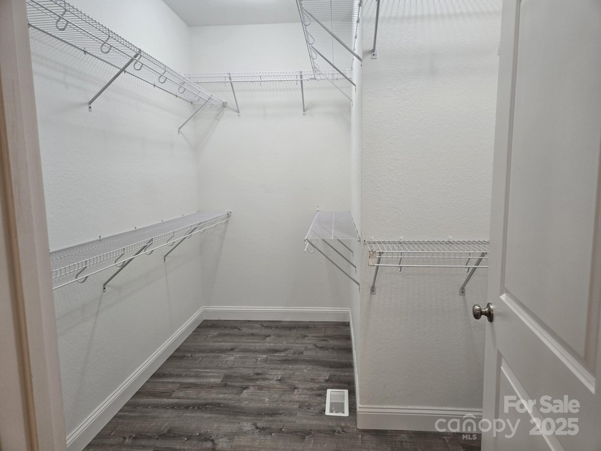 119 Tryon View Drive Flat Rock, NC 28731 - Photo 14 of 22 a view of walk in closet with empty racks