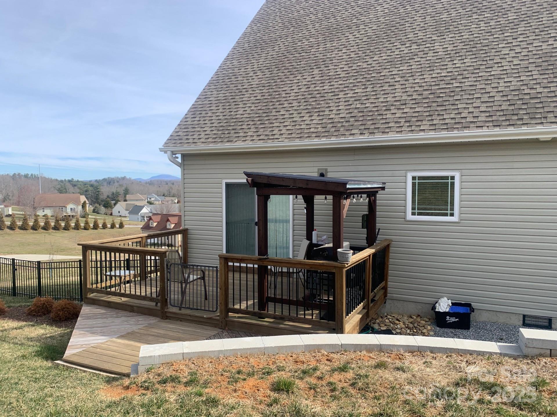 119 Tryon View Drive Flat Rock, NC 28731 - Photo 2 of 22 a view of a house with wooden fence