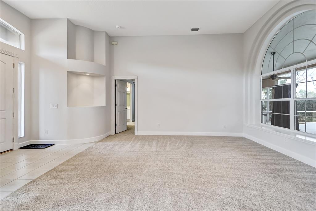 16 Edgar Lane Palm Coast, FL 32164 - Photo 11 of 53 a view of an empty room with a window